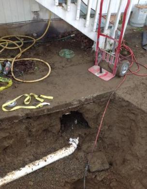 Sewer line exposed during an open trench replacement